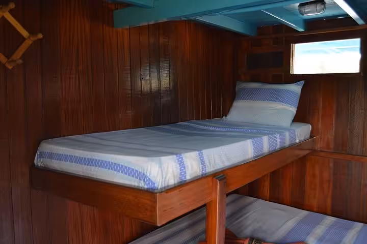Private cabin bunk bed on Manaus to Tabatinga Amazon boat, comfortable overnight river cruise accommodation