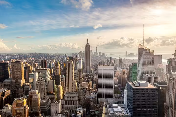 Aerial view of Manhattan skyline with Empire State Building and skyscrapers on a sunny day
