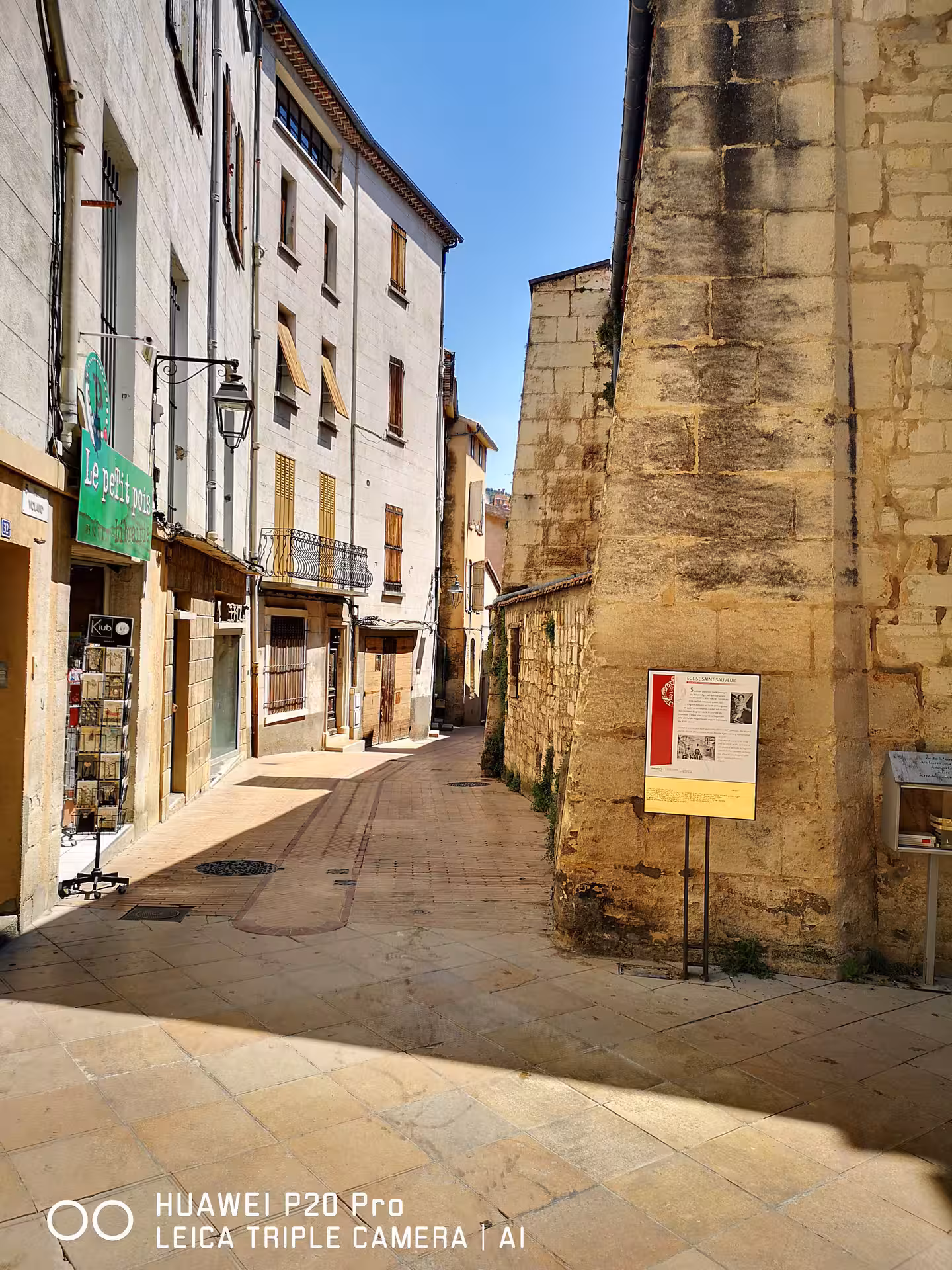 Sunlit stone street in Manosque old town, Provence, on a private Marseille shore excursion day trip
