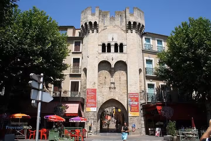 Historic stone gate in Manosque old town, Provence stop on Marseille shore excursion private day tour