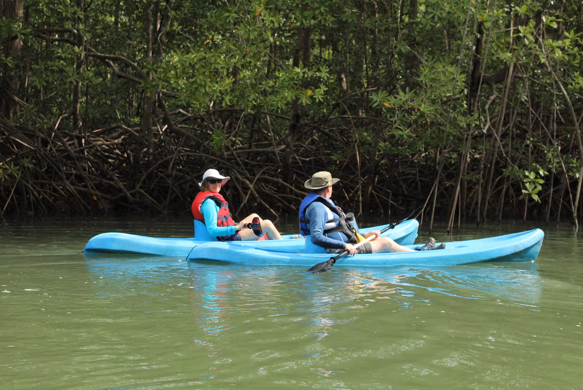 Tourists kayaking through Manuel Antonio's mangroves, enjoying wildlife and nature on the Mangrove Monkey Tour.