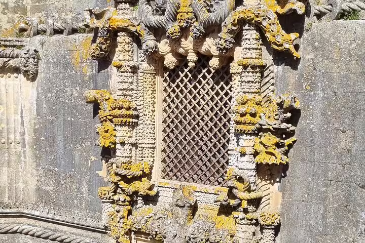 Intricate Manueline window detail at Convent of Christ, Tomar, highlighting Templar history on a private guided day tour.