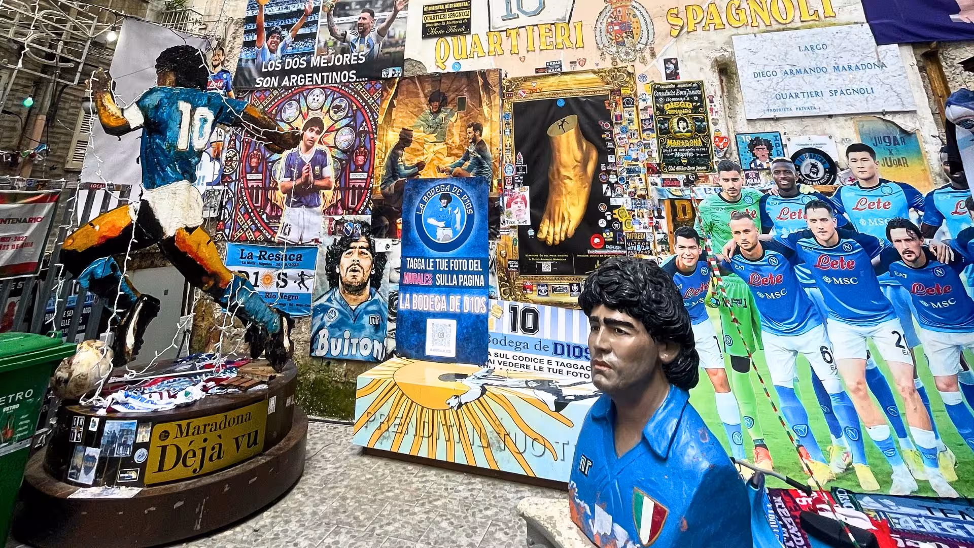 Colorful tribute to Maradona with murals and memorabilia on display in historic Via Toledo, Naples.