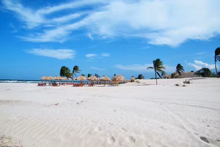 White sand dunes and beach kiosks on Marajó Island, Brazil, highlight of a 2D1N Amazon island tour