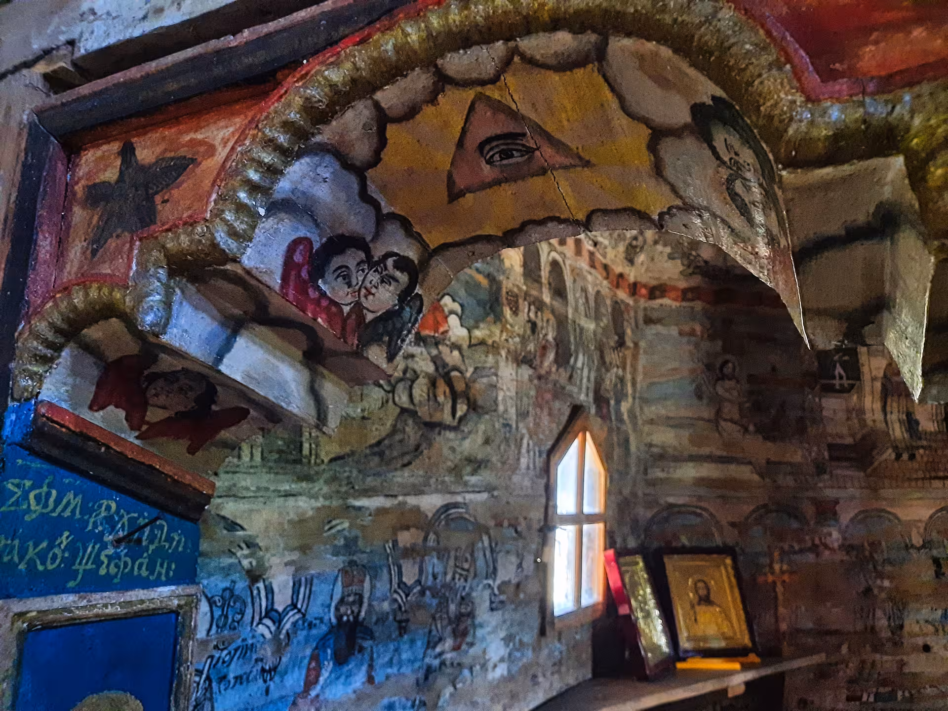 Ancient colorful interior frescoes inside a UNESCO wooden church in Maramures Romania on a rural village guided tour