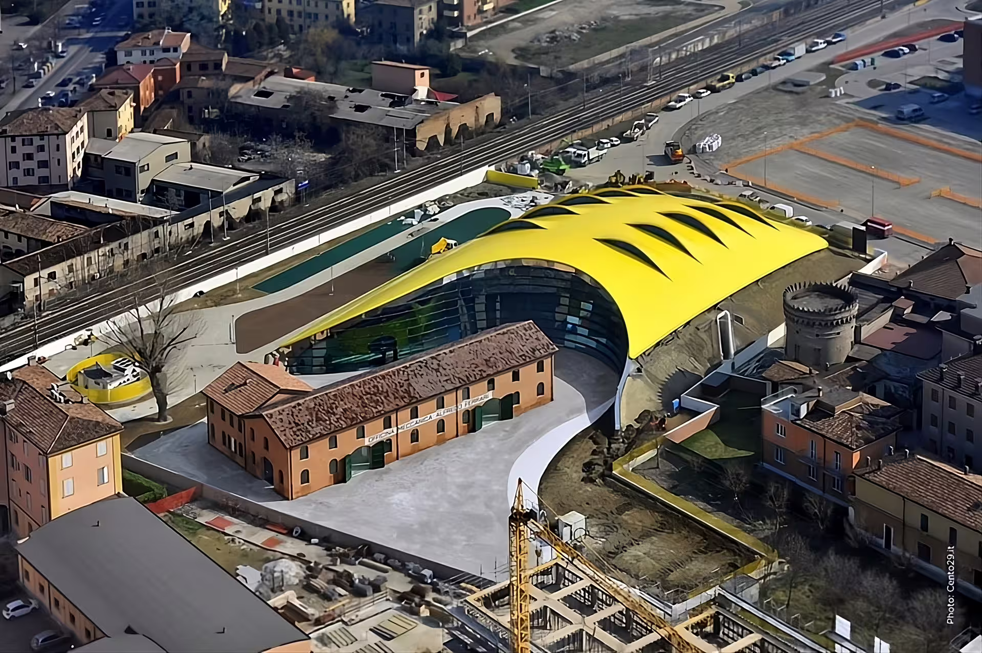 Aerial view of Museo Ferrari Maranello with iconic yellow roof, included in Modena Maranello combo ticket