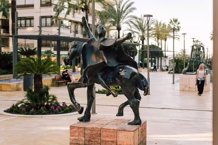 Artistic sculpture of a rider on horseback in Marbella Old Town, showcasing local culture on a walking tour.