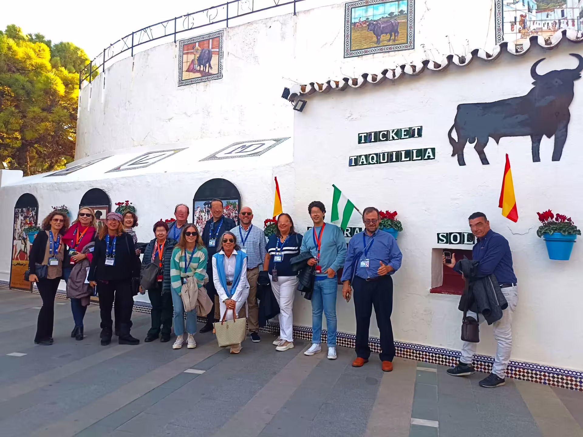 Private Marbella and Mijas day trip group photo at a traditional bullring ticket office, Costa del Sol