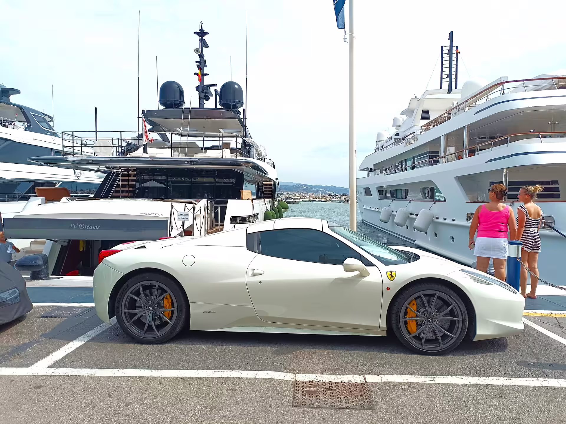 Luxury yachts and supercars at Puerto Banus marina, Marbella private tour with hotel pick-up on Costa del Sol