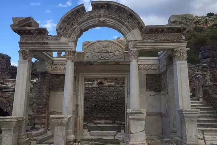 Ornate marble arch ruins in Ancient Ephesus on a private less-walking tour from Kusadasi, Turkey