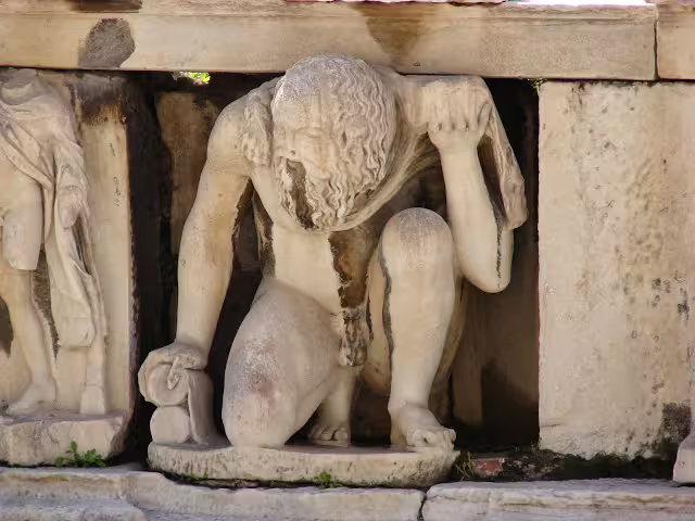 Marble Atlas statue holding the temple roof at the Acropolis, highlight on Acropolis Museum tour Athens