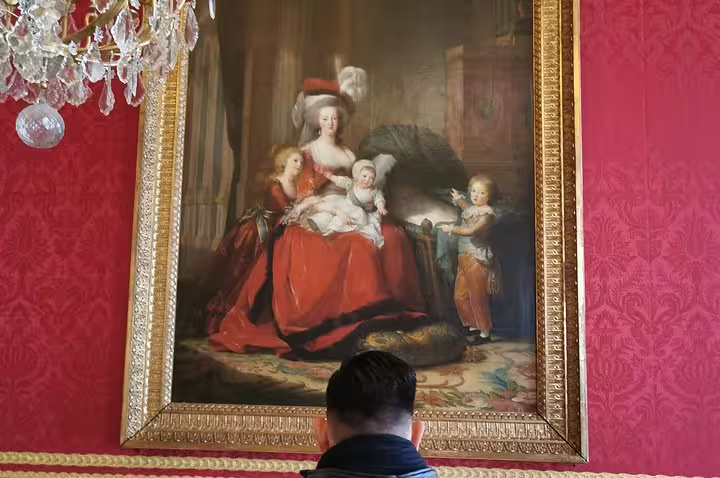 Marie Antoinette family painting in Versailles Palace room, seen on guided skip-the-line tour