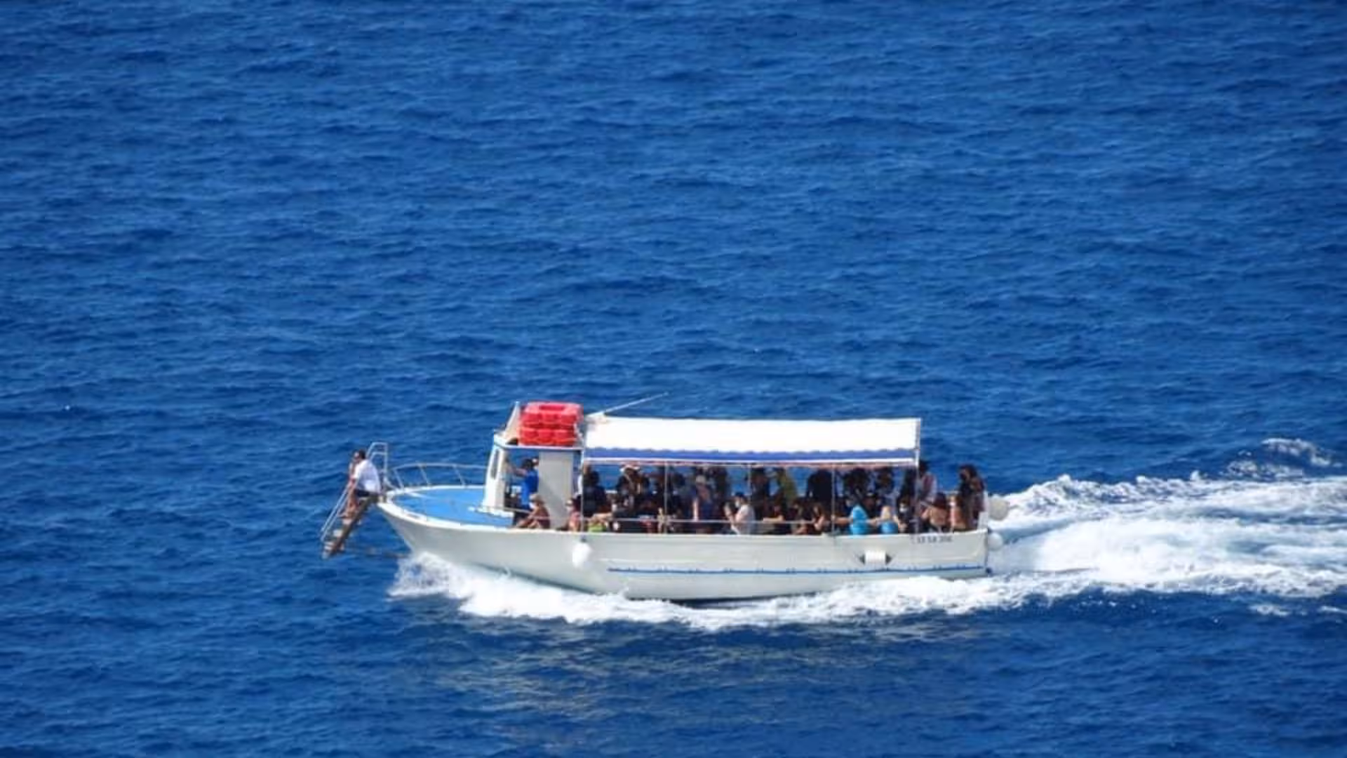 Join a scenic boat tour in Marina di Camerota, cruising through the vibrant blue waters of Baia Infreschi.