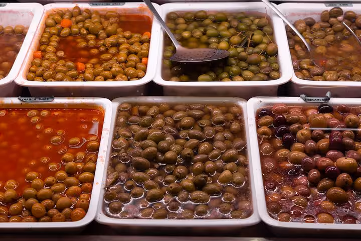 Assorted marinated olives at La Boqueria Market, a classic tasting on a Barcelona local markets food tour