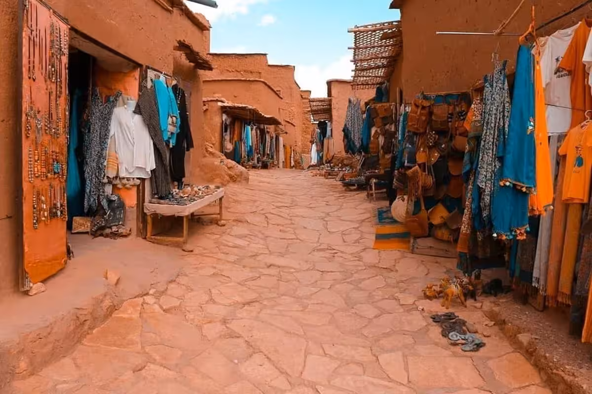 Traditional market in Moroccan village, showcasing local crafts on Marrakech to Fez desert tour.