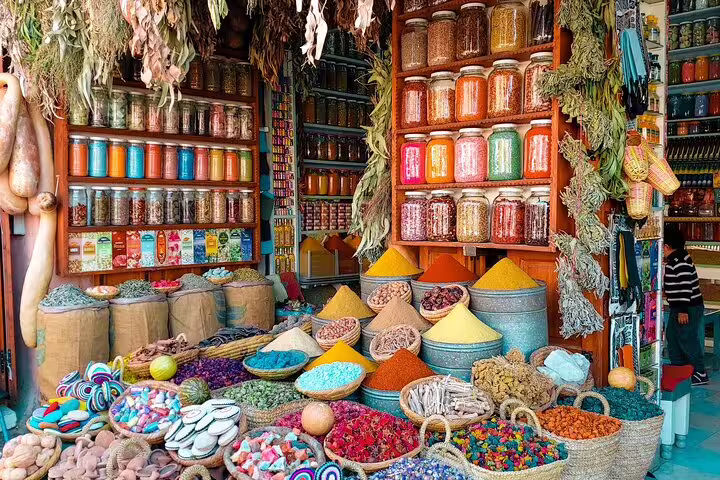 Colorful Marrakech souk spice market on Morocco 10 days tour from Casablanca, herbs, teas and baskets
