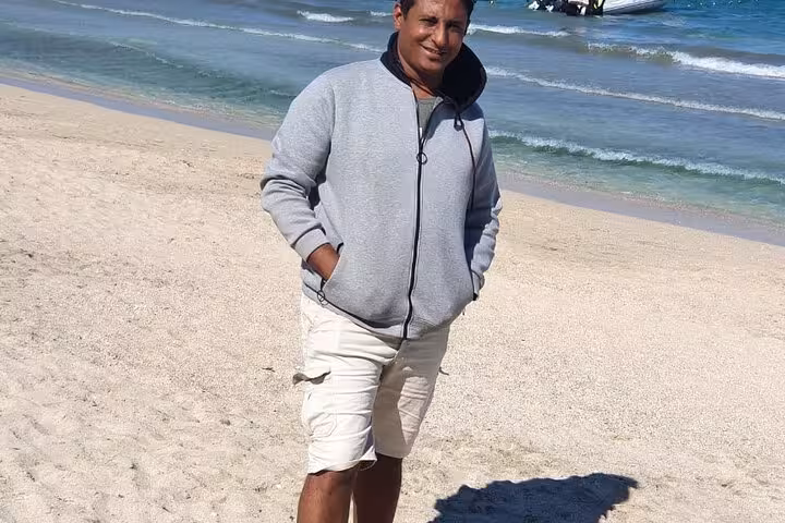 Local guide on Marsa Alam beach by the Red Sea, meeting point for private swim with turtles and dugong tour