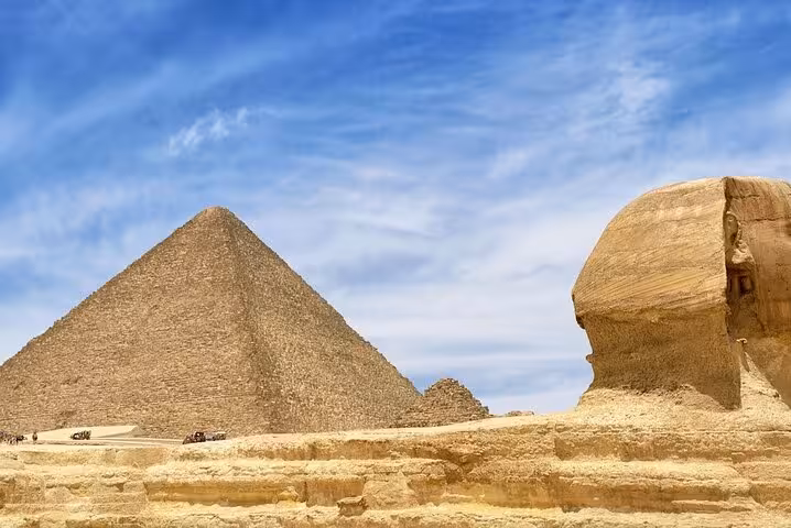 Great Sphinx and Giza Pyramid under blue sky, highlight of private Marsa Alam to Cairo flight day tour