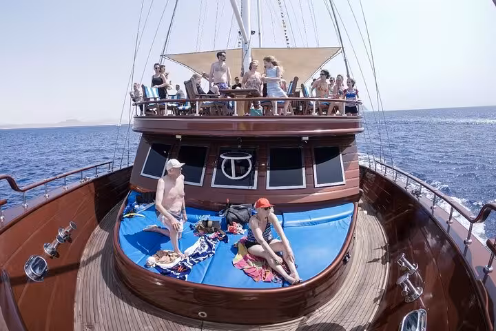 Sunbathing deck on Marsa Alam pirates sailing boat cruise, relaxing on Red Sea en route to Turtle Bay snorkeling