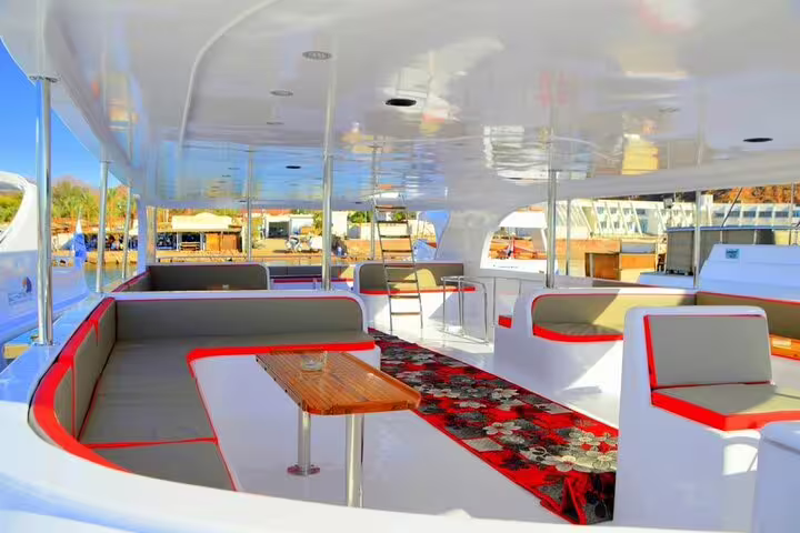 Spacious shaded boat lounge on Marsa Alam snorkeling tour to Marsa Mubarak to spot dugongs and turtles