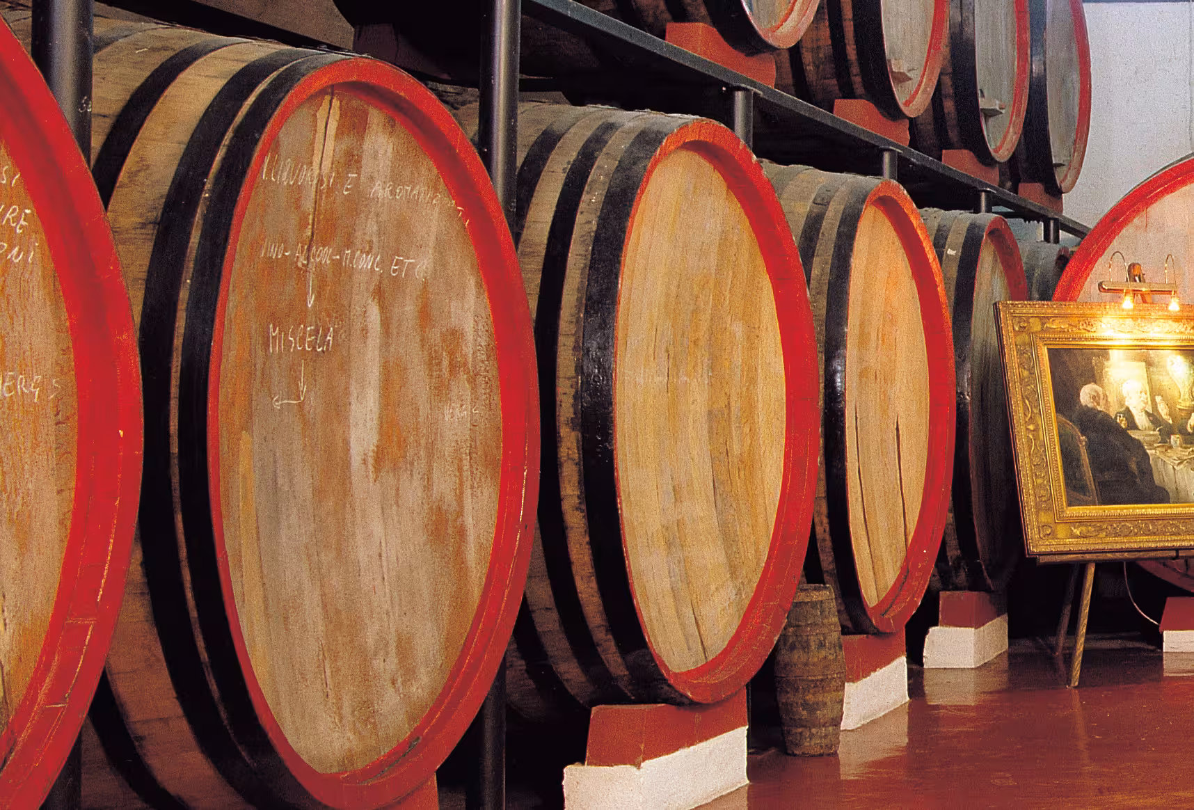 Oak barrels aging Marsala wine in cellar, part of 7-wine tasting experience with traditional Sicilian dishes