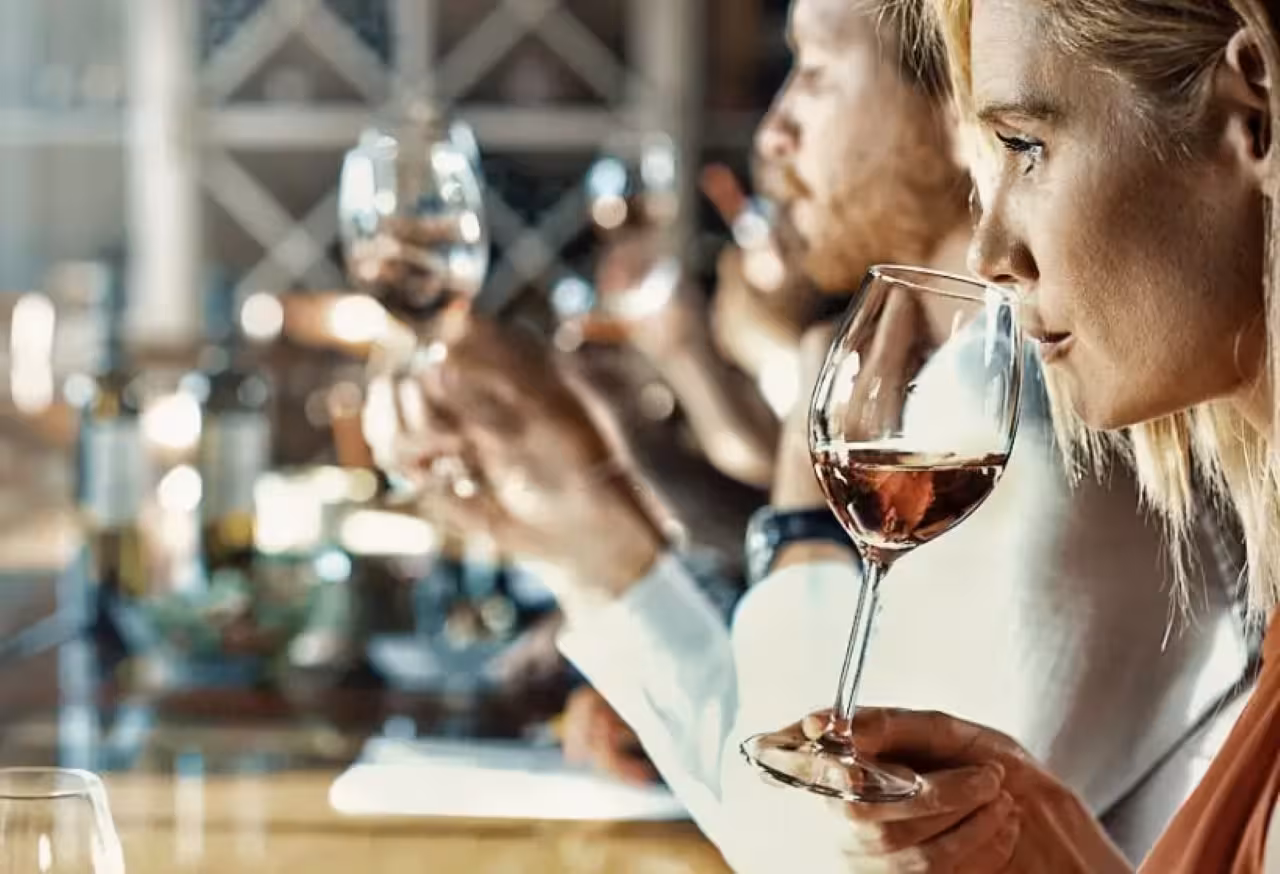 Guests swirl and sip Marsala wine during guided tasting of 7 wines paired with traditional Sicilian dishes in Marsala
