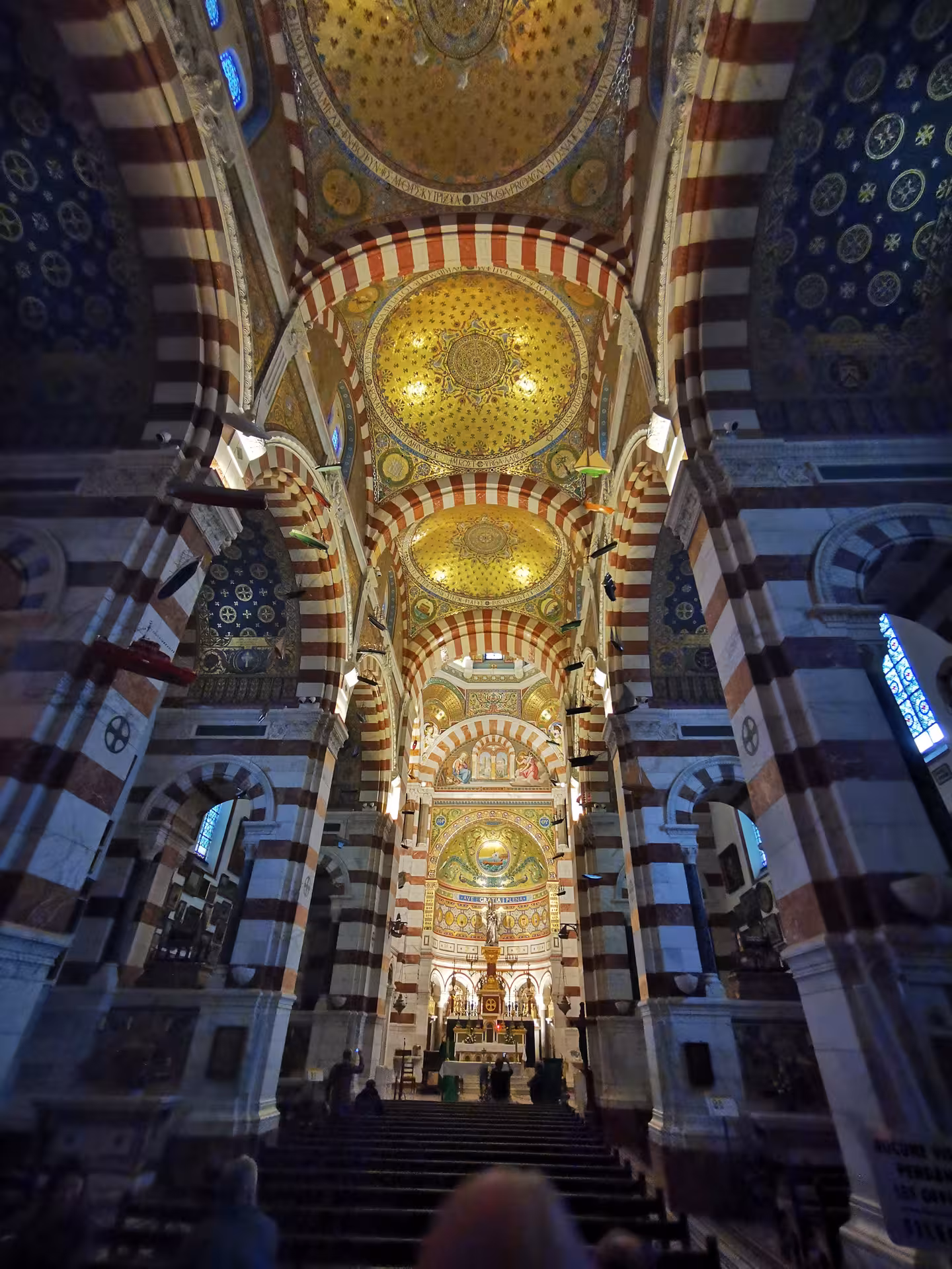Marseille half-day city tour inside Cathédrale La Major, showcasing ornate domes and striped arches near the Old Port