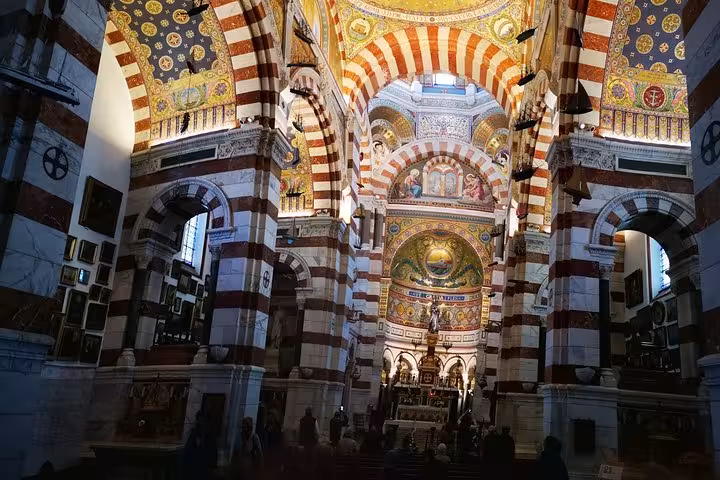 Interior of Marseille Cathedral La Major with striped arches, featured on private city tour and transfer service