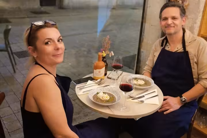 Guests enjoy a Marseille cooking workshop meal with a local chef, Provençal dishes and red wine pairing