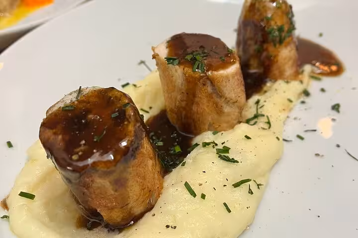 Plated Provençal main course with mashed potatoes and rich sauce from Marseille cooking workshop with local chef