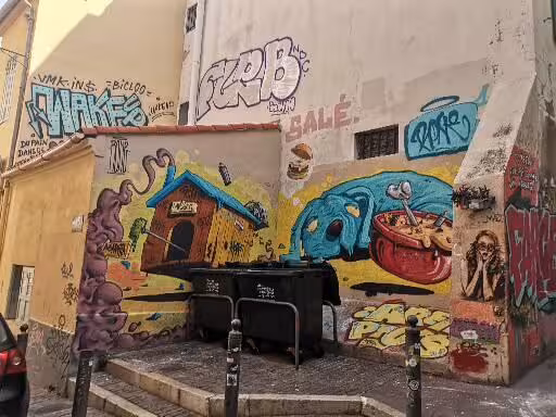 Colorful Marseille old district street art mural on alley wall, highlight of craft and wine walking tour