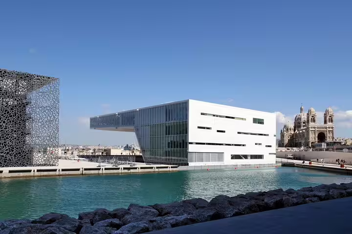 MuCEM museum and Cathedral de la Major on Marseille waterfront with turquoise harbor waters