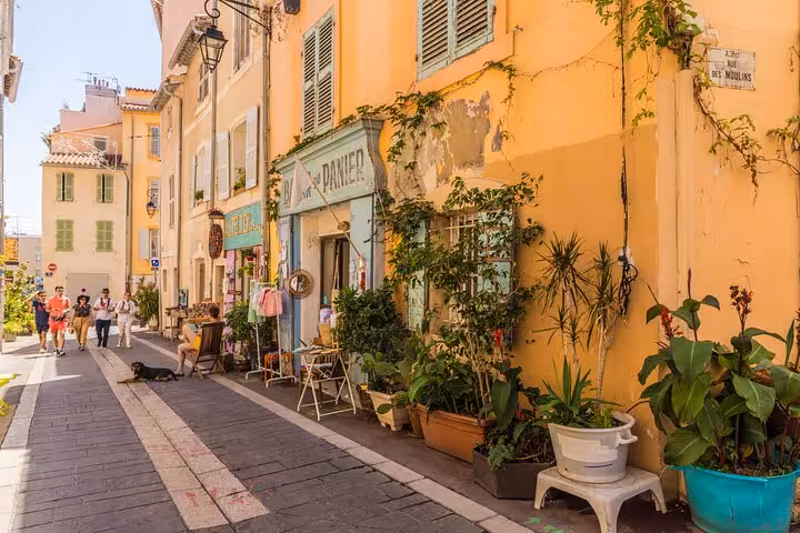 Charming Marseille street with colorful facades and boutiques, ideal stop on a private driver sightseeing tour
