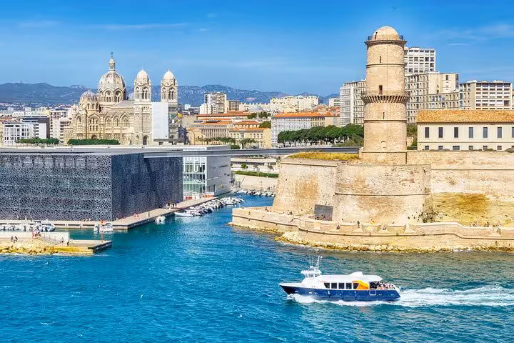 Explore Marseille's iconic harbor with historic fort and cathedral views on a private 2-hour walking tour.
