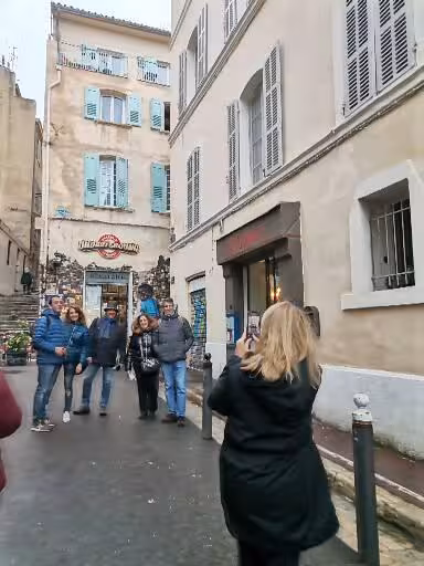 Guided walking tour in Marseille old town street, part of 11-day Provence Christian heritage cultural itinerary