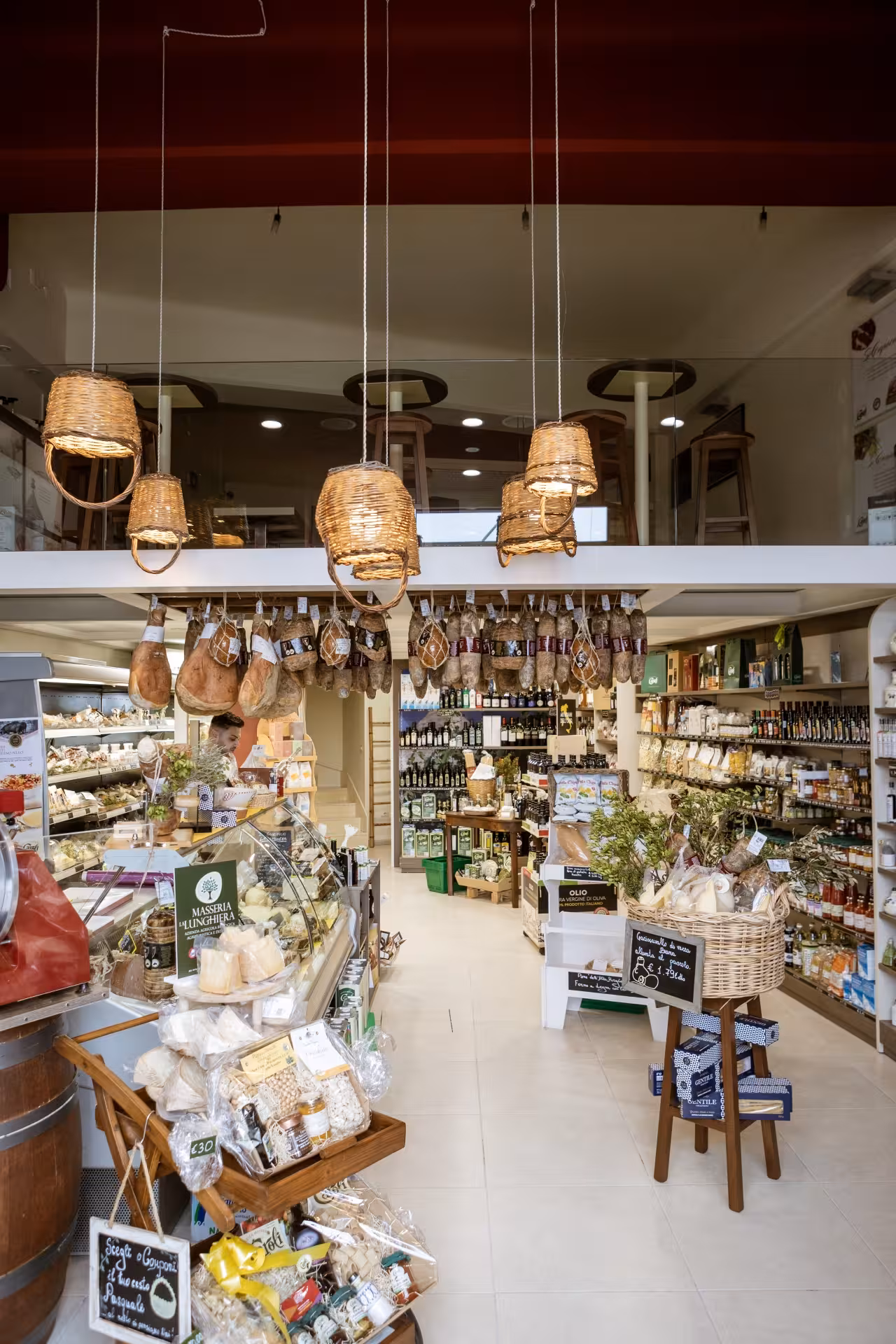 Martina Franca food shop with hanging capocollo, local wines and Puglia deli specialties tasting tour