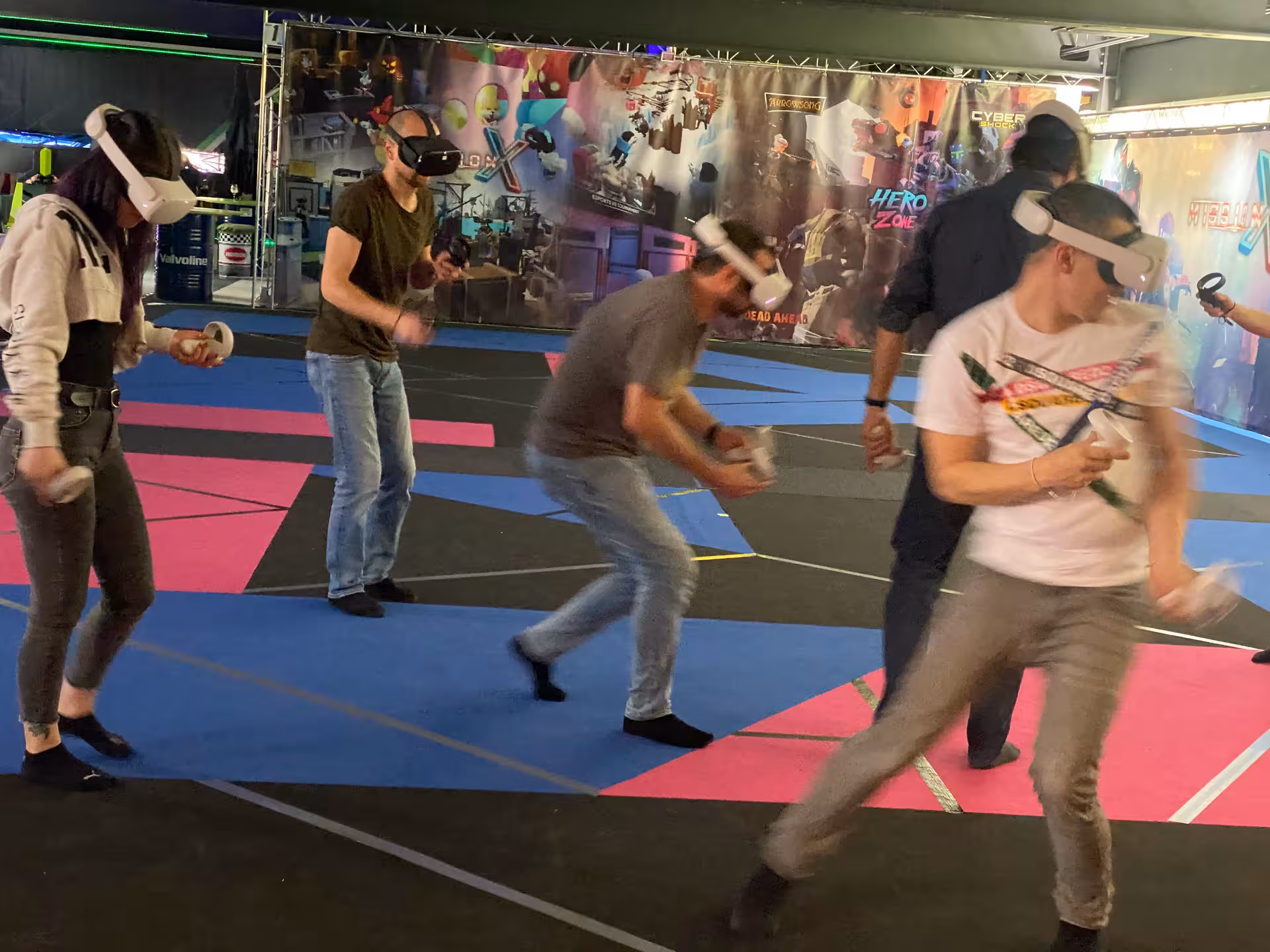 Group playing Matrix X free-roam VR with headsets and controllers, action-packed multiplayer virtual reality