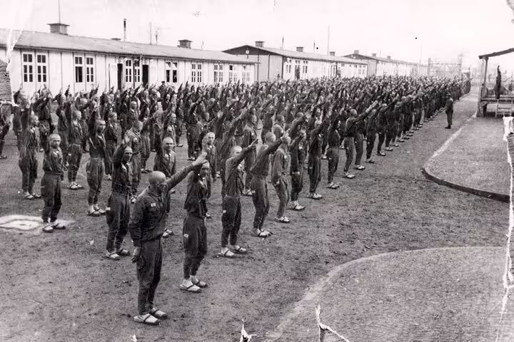 Historic photo of prisoners lined up at Mauthausen camp barracks, part of Vienna private memorial trip
