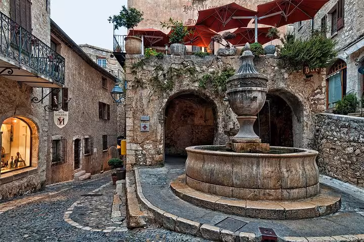 Historic stone fountain in a medieval village square on the French Riviera near Nice