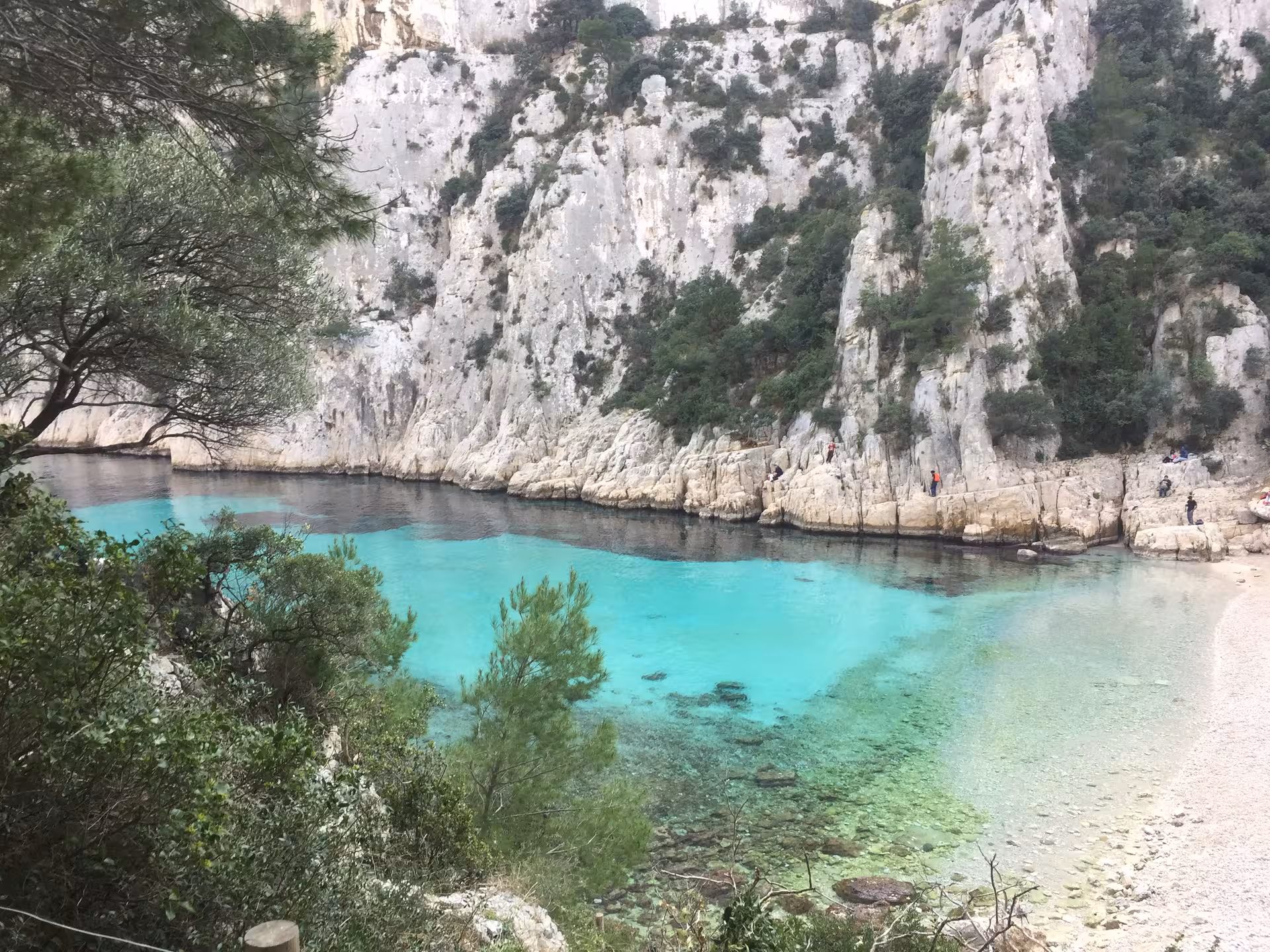 Turquoise Mediterranean cove below limestone cliffs, ideal stop for 3-day boating and snorkeling tour