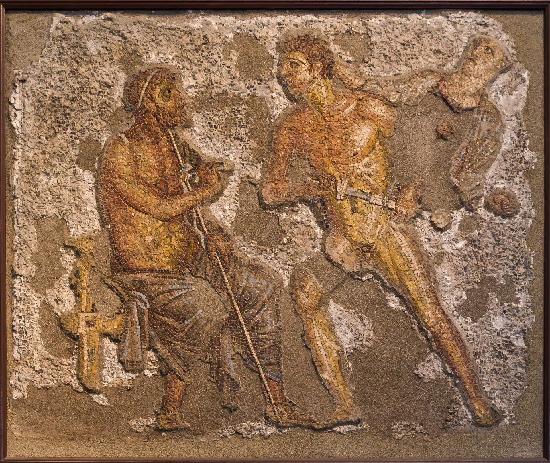 Ancient Mediterranean mosaic of two mythological figures, a seated elder and a running youth, on a 9‑day Italy self‑drive tour