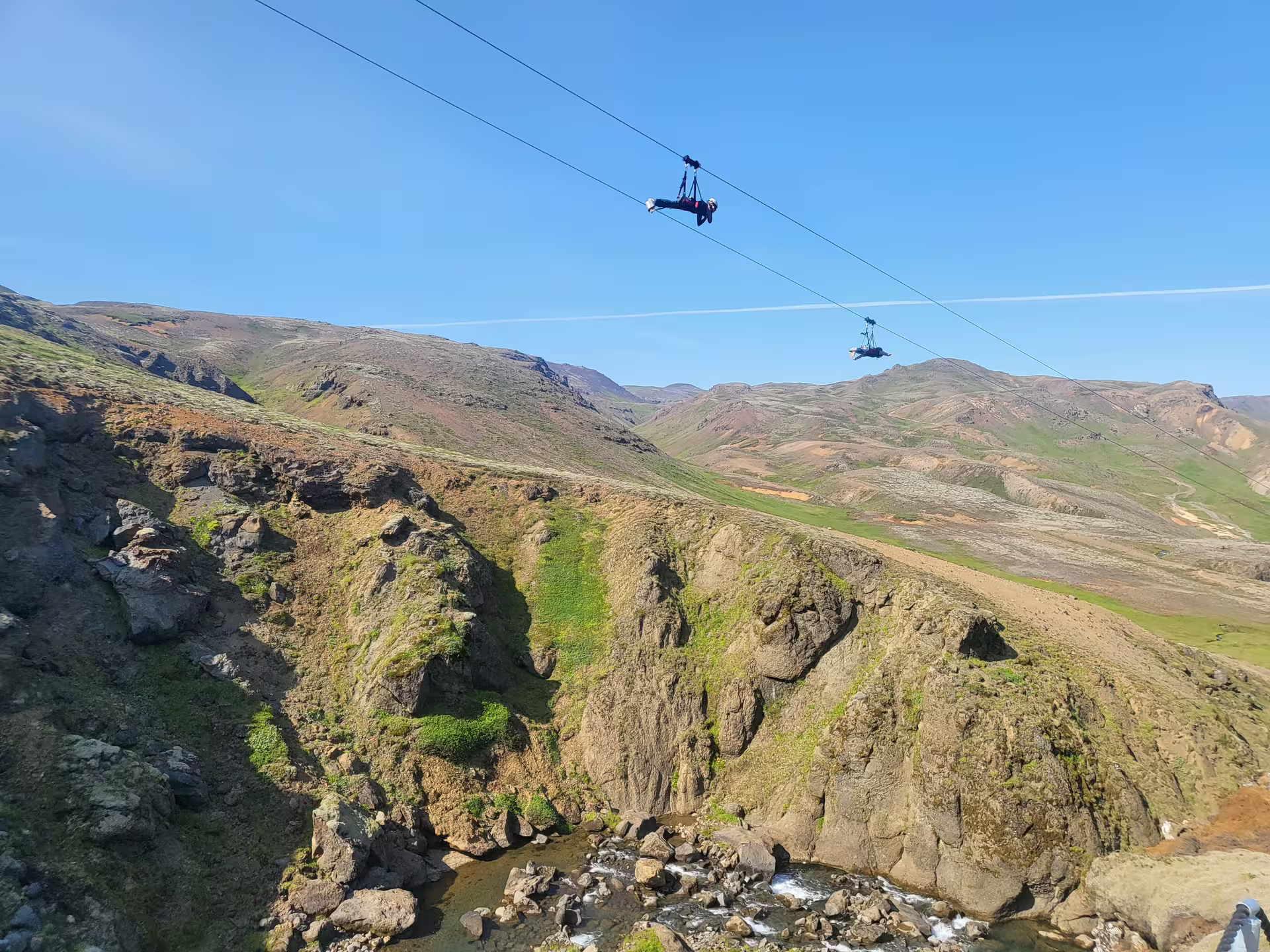 Adventurers soar on a thrilling Mega Zipline Superman Ride above stunning Icelandic landscapes near Reykjavik.