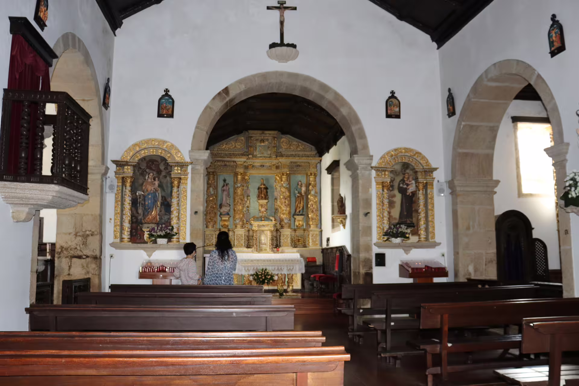 Interior of a historic church in Melgaço, Portugal, showcasing ornate altars and architecture on a private Alvarinho wine tour.