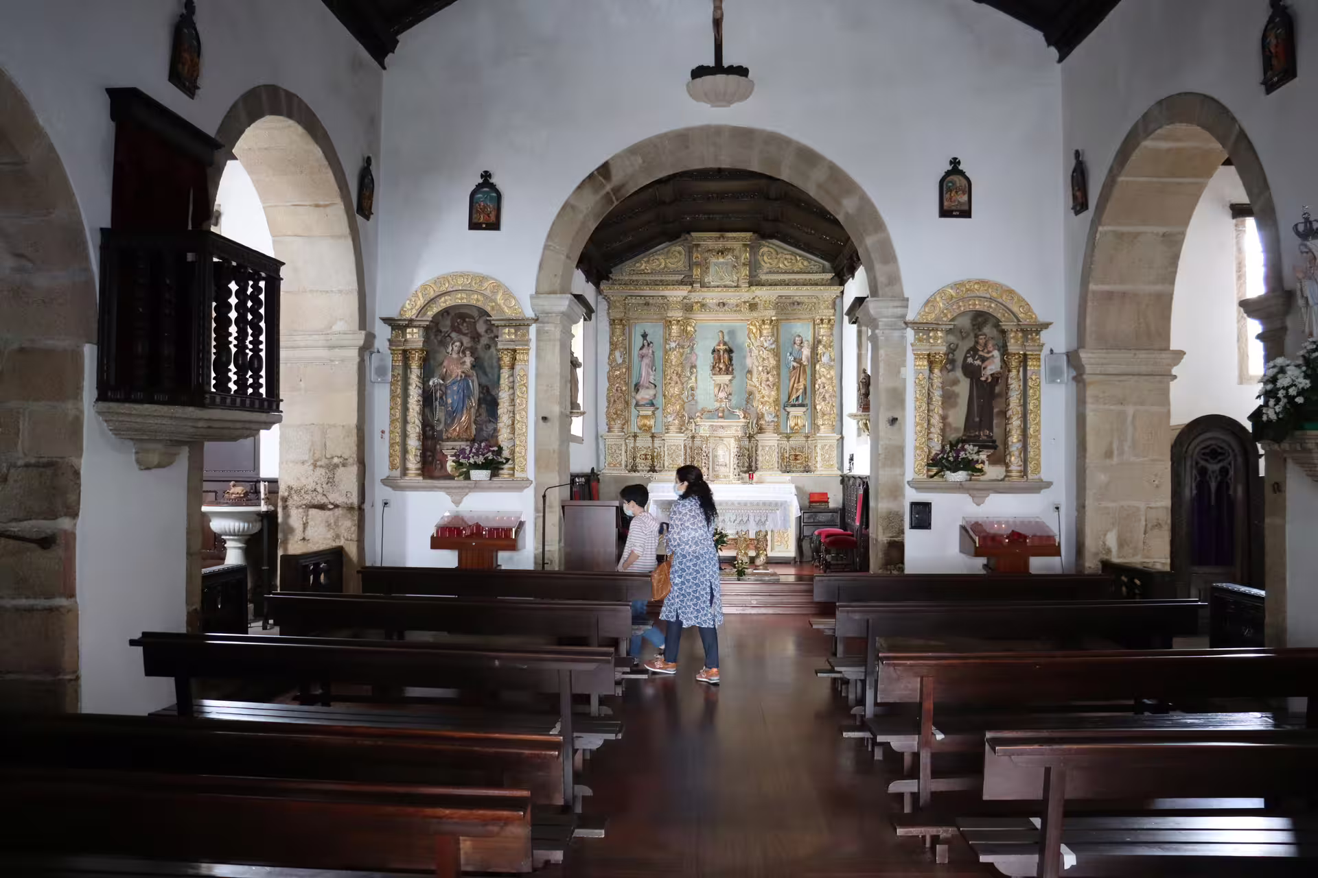 Interior of a historic church in Melgaço, showcasing intricate religious art and architecture during a private Alvarinho wine tour.