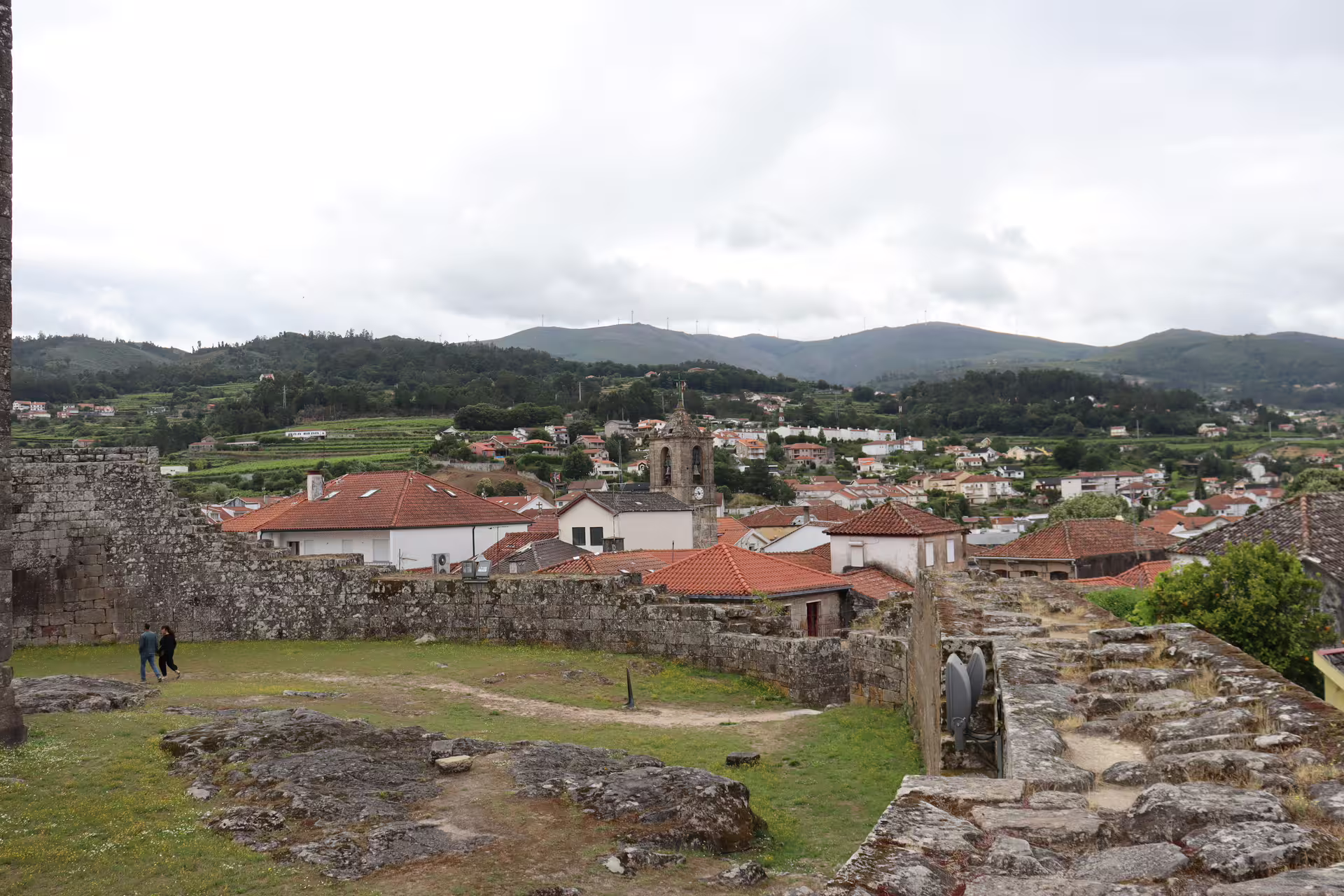 Scenic view of Melgaço village with historic stone walls and lush vineyards, perfect for a private Alvarinho wine tour.