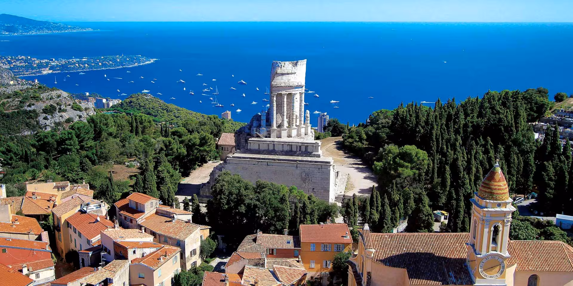 Aerial view of Menton old town with Roman Trophy of Augustus monument overlooking the Mediterranean Sea