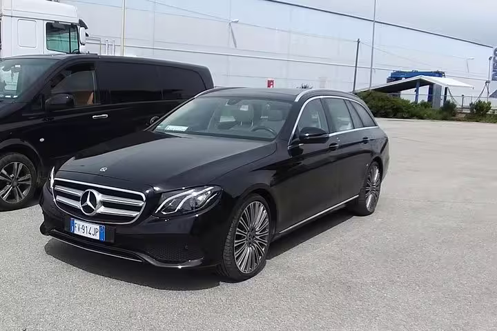 Premium black Mercedes E-Class estate car ready for private airport transfer service from Karlsruhe to Baden-Baden