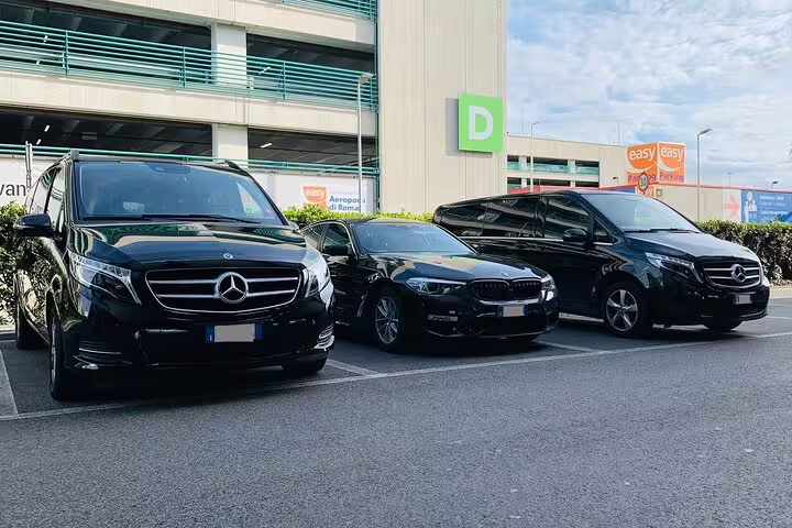Luxury Mercedes vans and sedan fleet parked at airport for private transfer Girona Airport to Palamos round trip