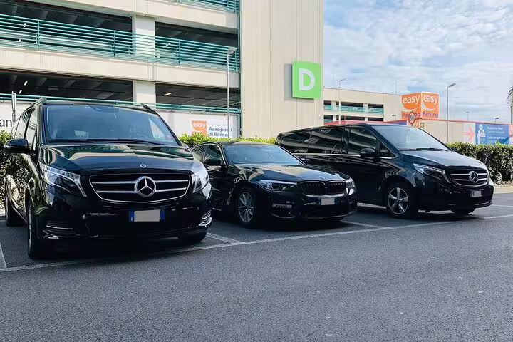 Luxury black Mercedes vans and sedan fleet parked at Malaga Airport AGP for private transfer to Malaga City