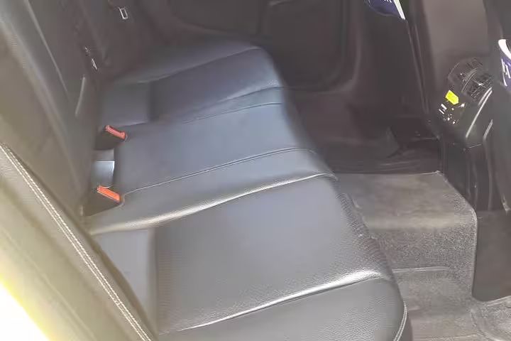 Spacious leather rear seats in Mercedes for private transfer Athens to Igoumenitsa, comfortable long-distance ride
